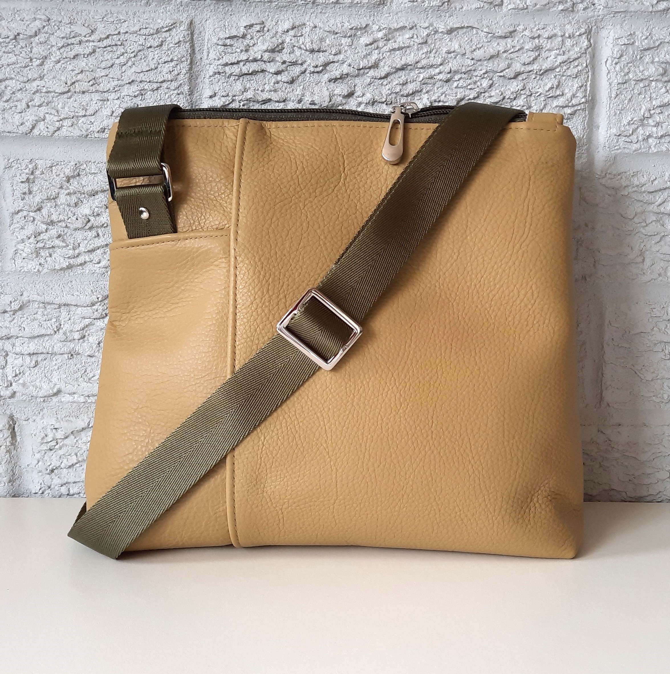 a tan bag with a strap