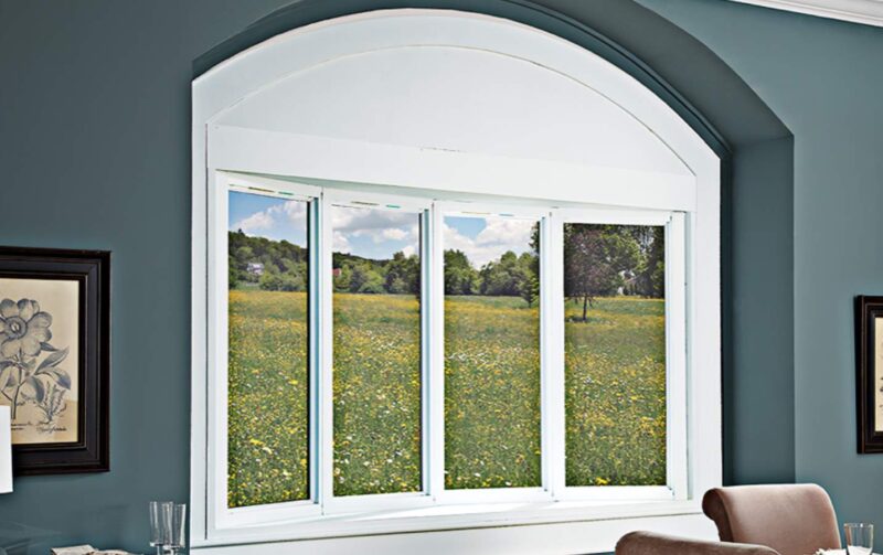 a window with a view of a field of flowers