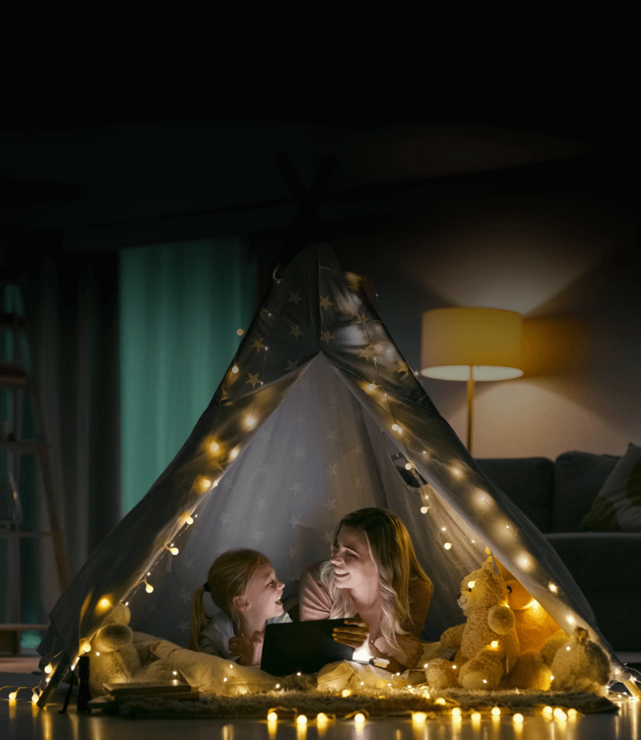 a woman and a girl in a tent