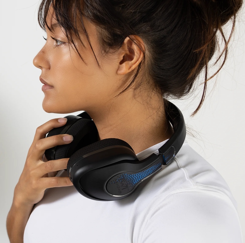 a woman wearing headphones around her neck