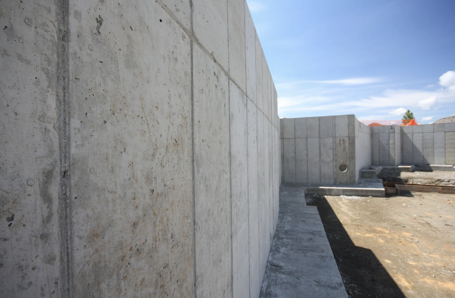 a concrete wall with holes in the wall