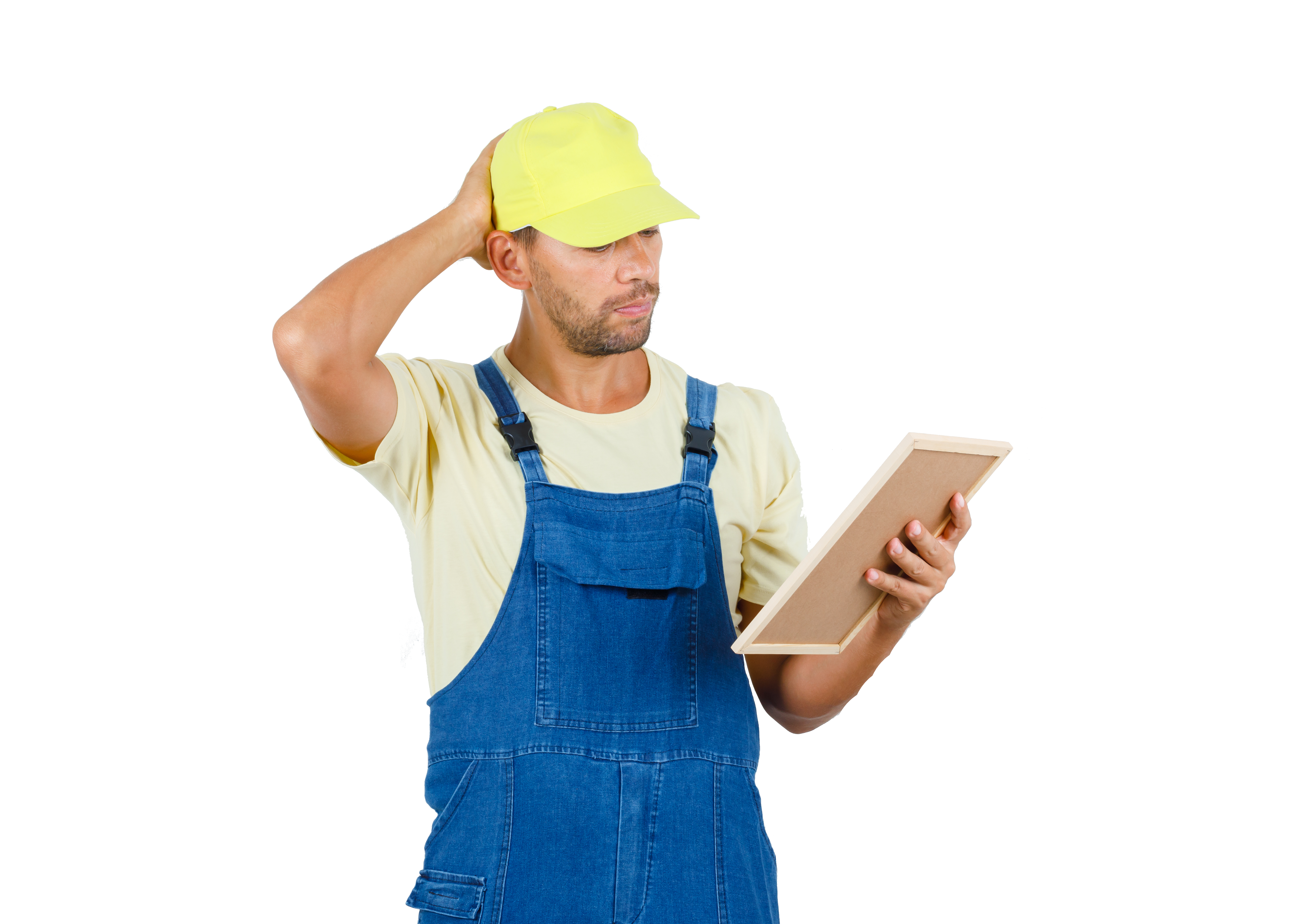 a man in overalls holding a board