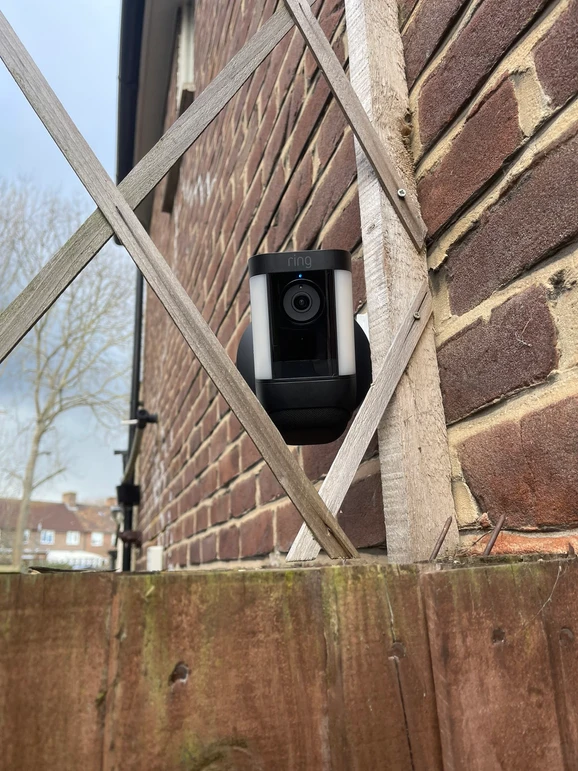 a camera on a brick wall