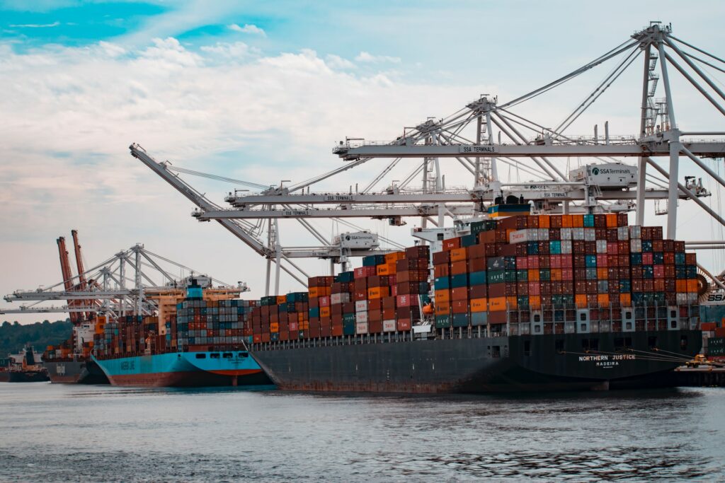 a large cargo ship with many containers on the side