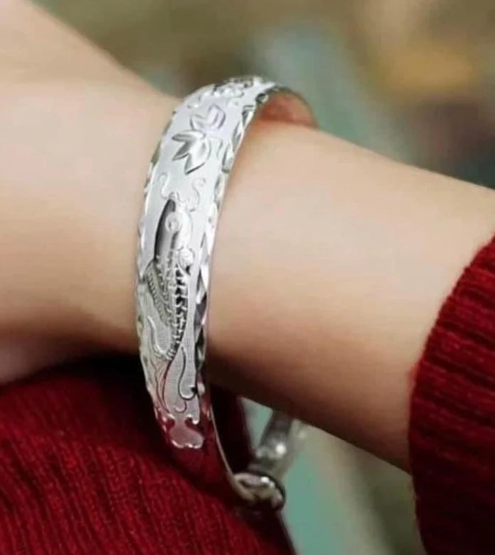 a silver bracelet on a person's wrist