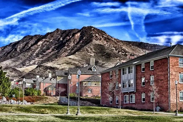 a group of buildings with a mountain in the background
