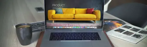 a laptop with a yellow couch