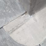 a close up of a concrete surface