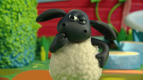 a black and white toy sheep
