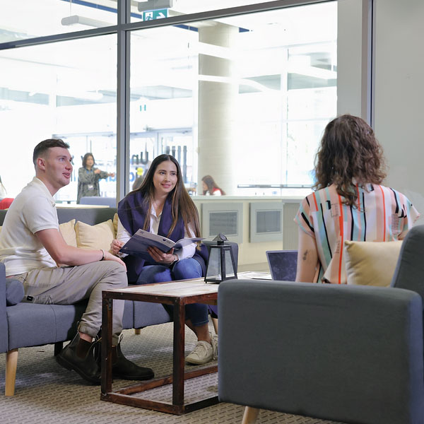 a group of people sitting on couches in a room