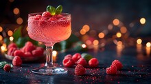 a glass of pink drink with berries