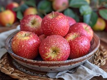 a bowl of apples on a table