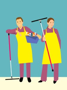 a man and woman wearing aprons holding objects