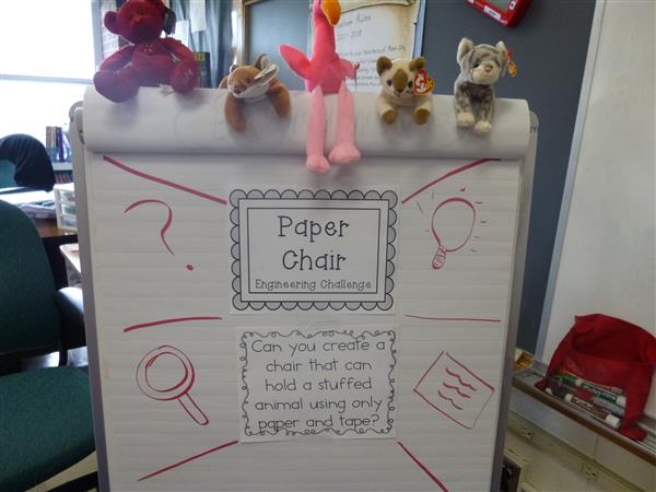 a white board with stuffed animals on it
