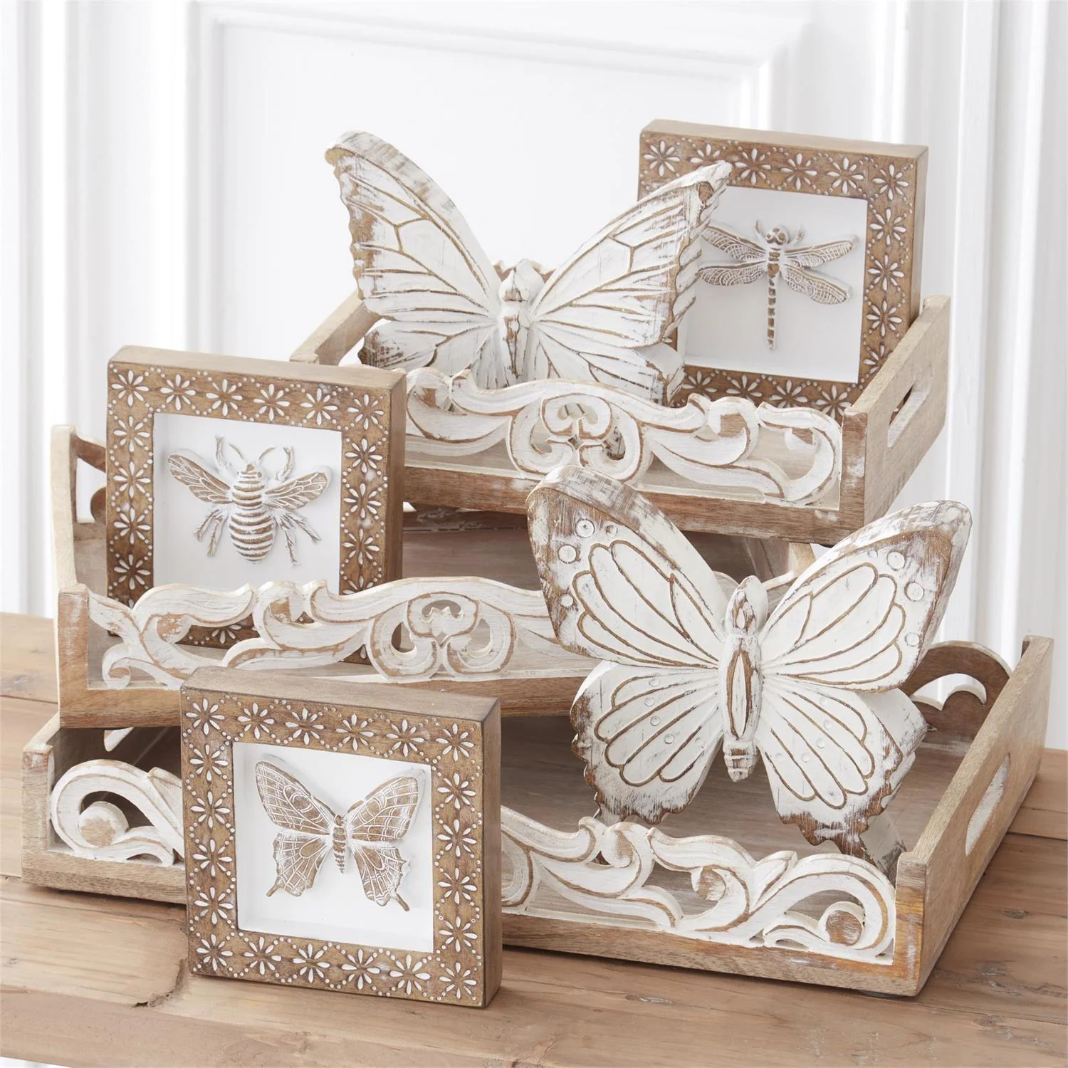 a group of wooden butterflies