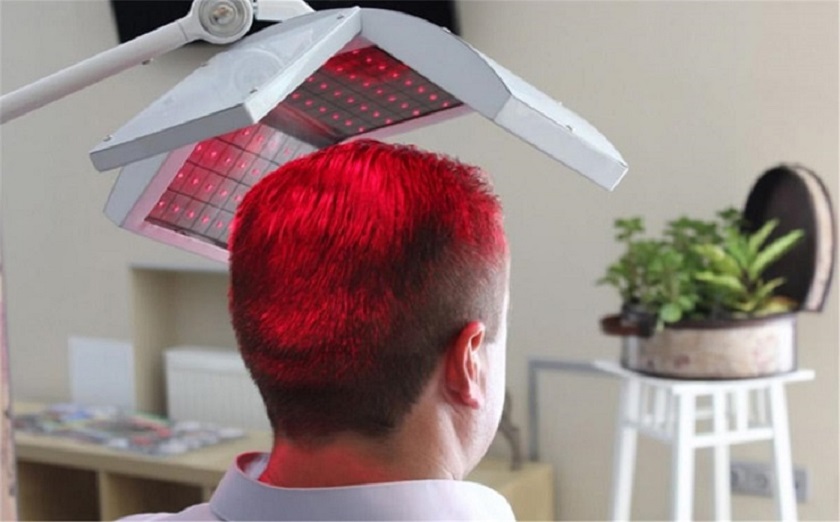 a man getting a red light on his head