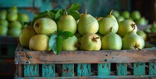 a group of pears in a wooden crate