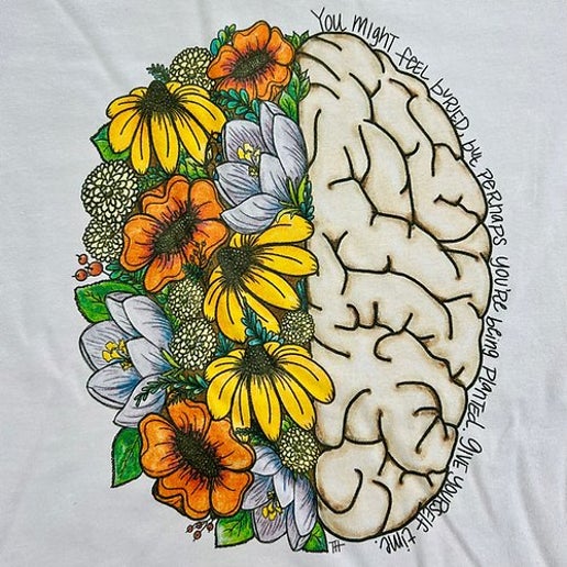 a brain with flowers drawn on it