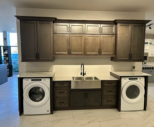 a laundry room with a sink and washer