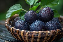 a basket of blueberries with water drops