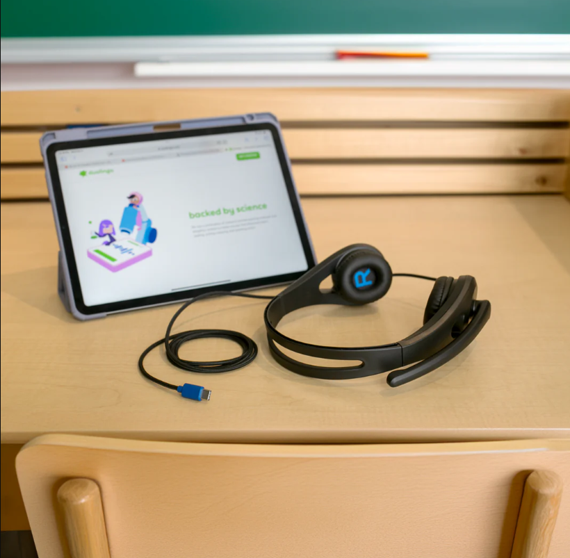 a laptop and headphones on a desk