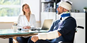 a man with a bandaged head sitting in front of a woman