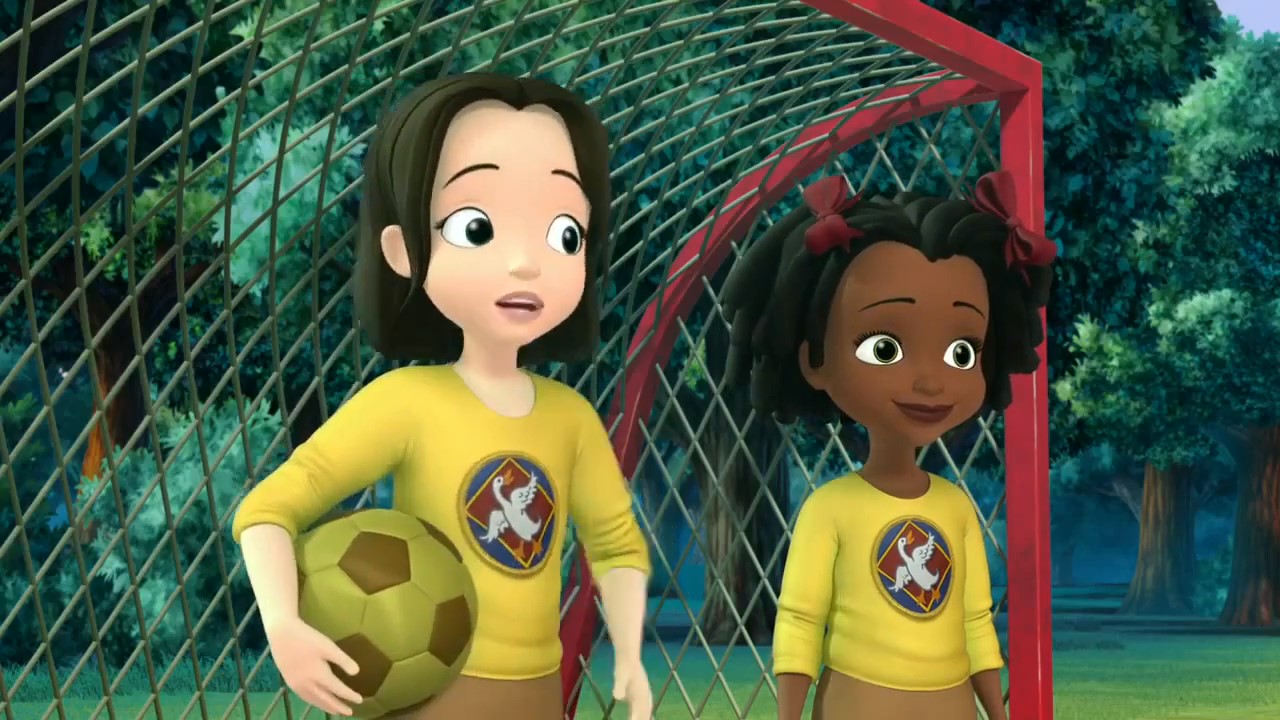 cartoon girls in yellow shirts with a football ball