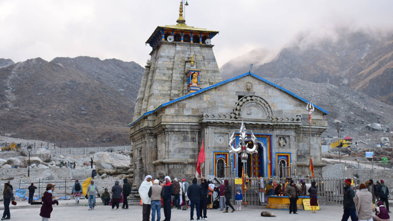 a group of people standing outside Kedarnath Temple