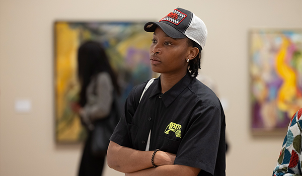 a woman in a black shirt with her arms crossed