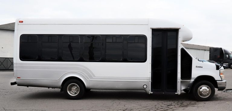 a white bus with black doors