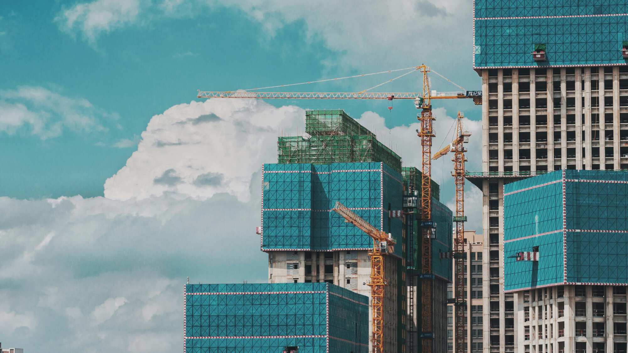 a construction site with cranes