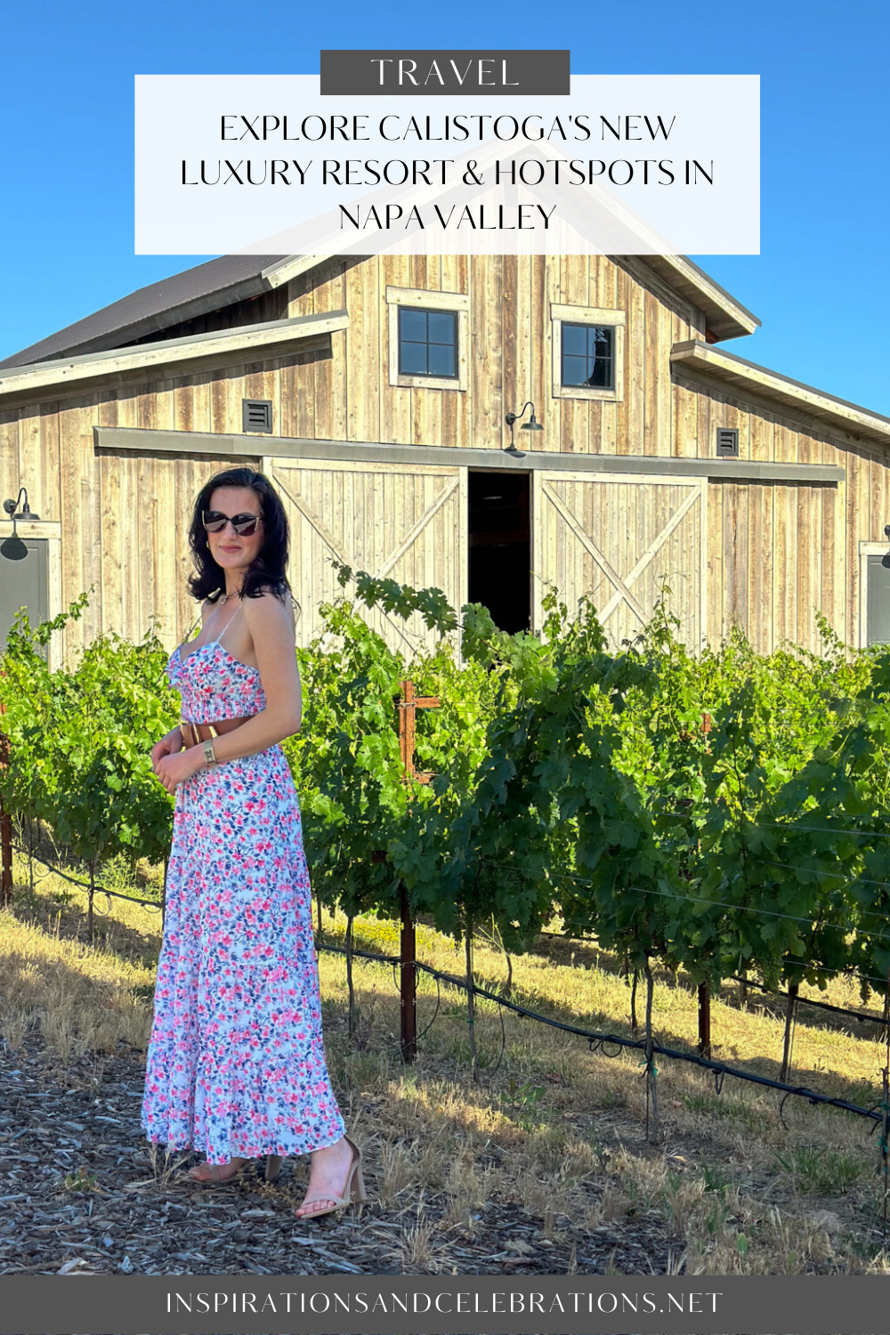 a woman in a dress in front of a barn