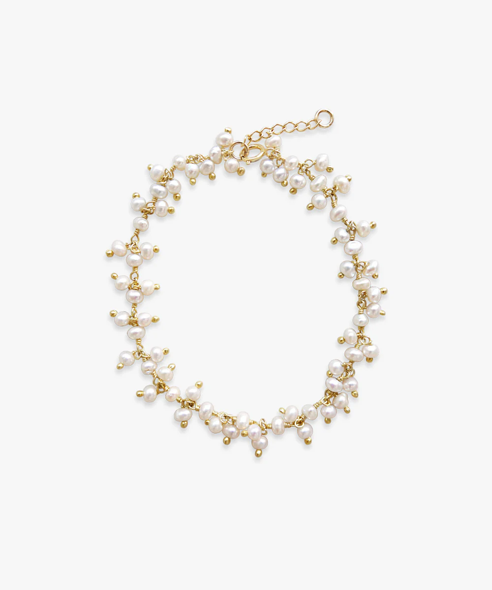 a gold and white bracelet
