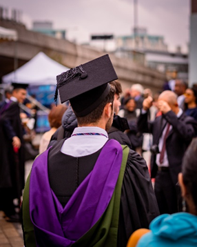 a man wearing a graduation gown