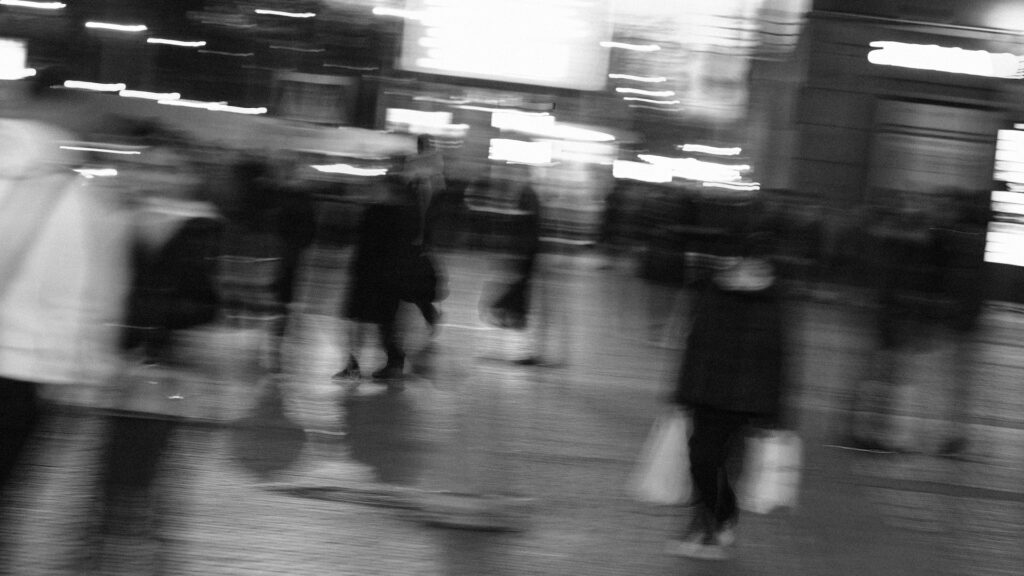 a blurry image of people walking