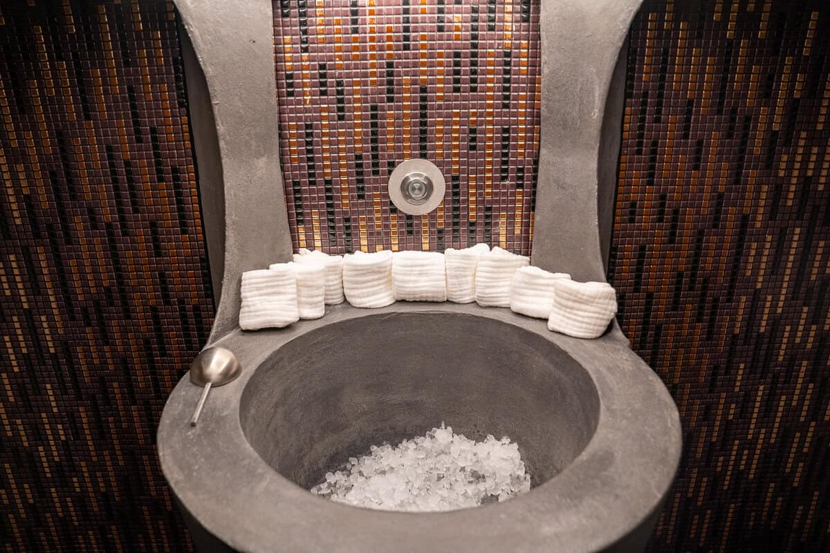 a toilet with ice and towels