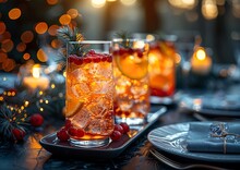 a group of glasses with drinks on a table