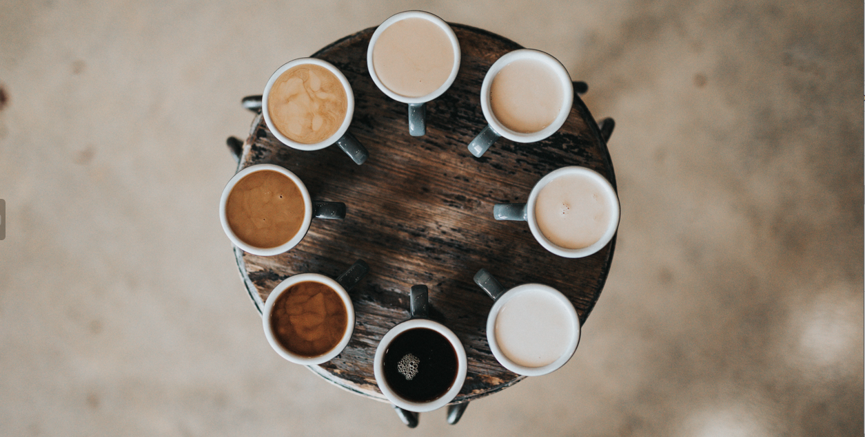 a group of mugs of coffee on a table