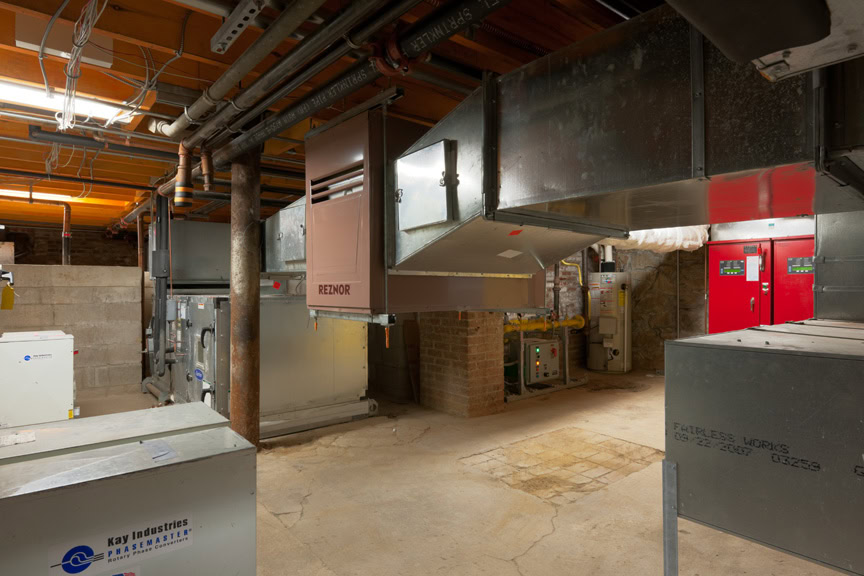 a room with large metal boxes and pipes