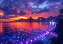 a body of water with lights and a city in the background