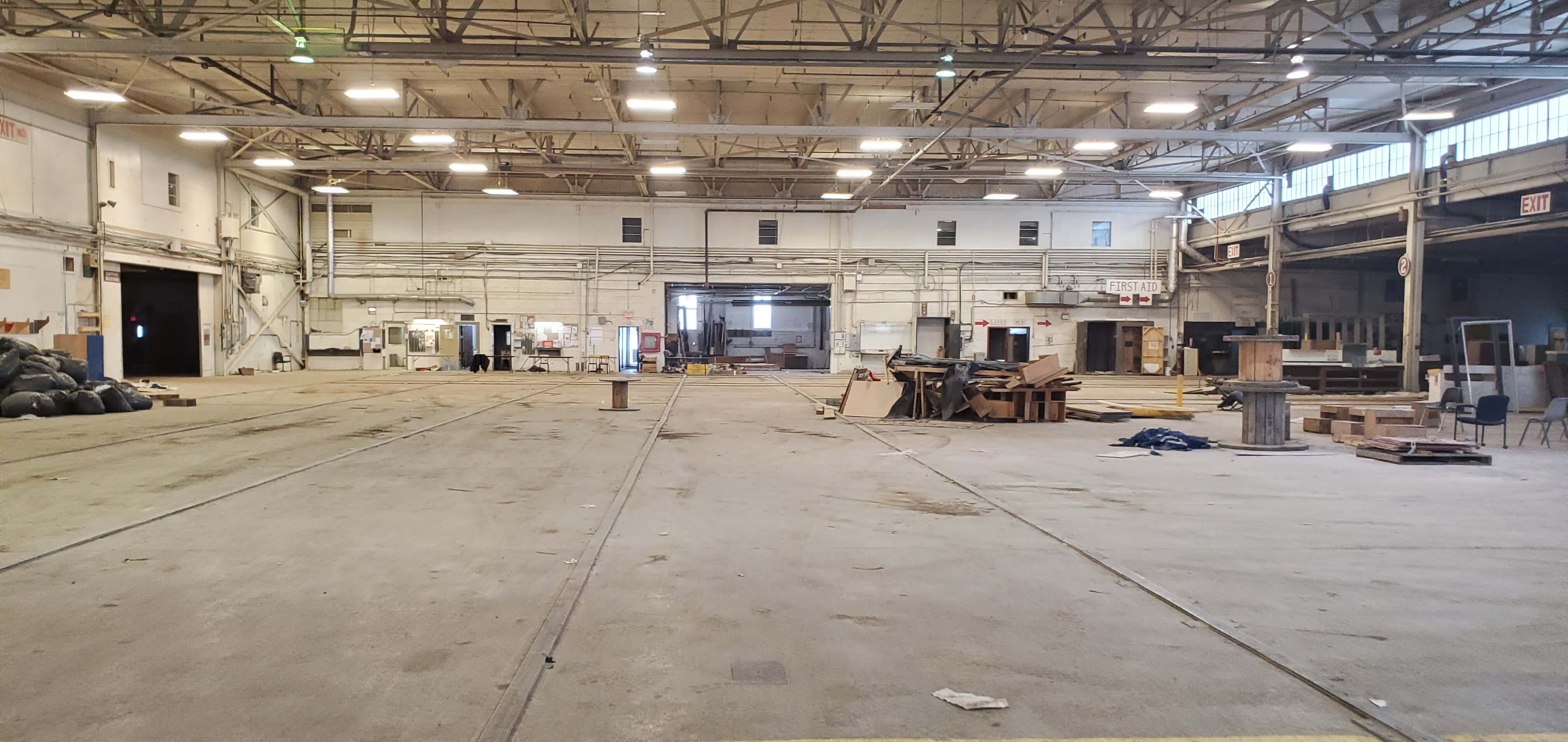 a large empty warehouse with lots of objects