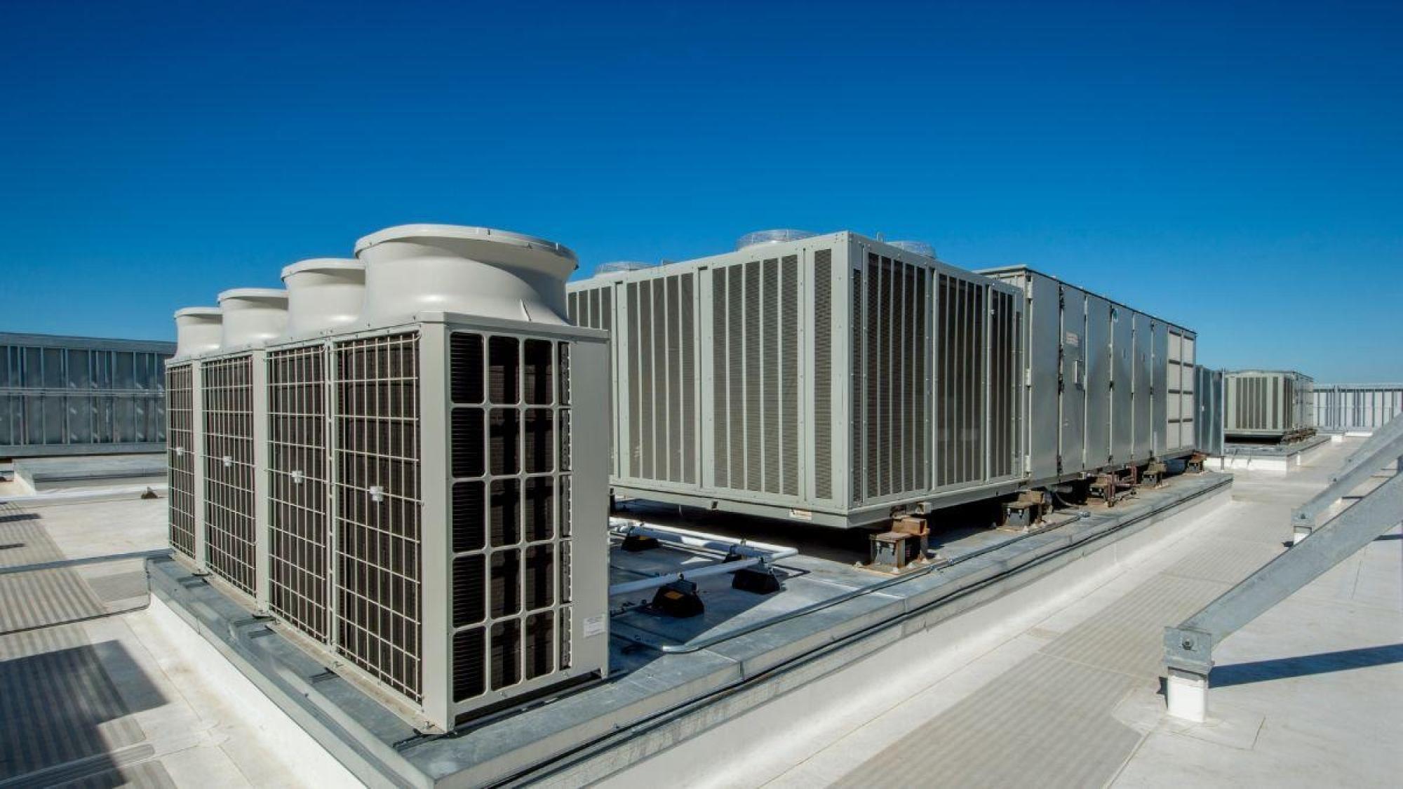several large air conditioning units on a roof