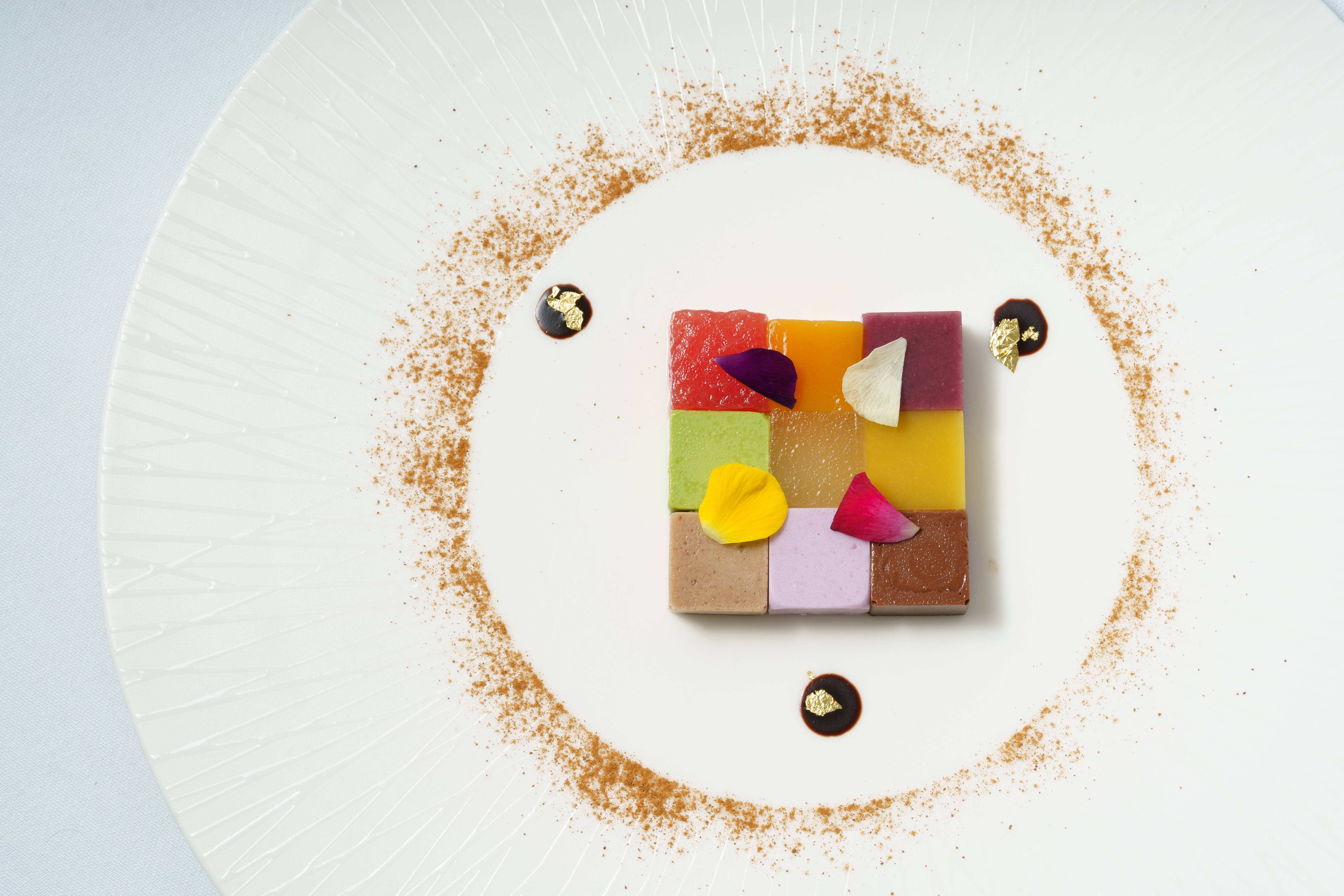 a plate with colorful desserts on it