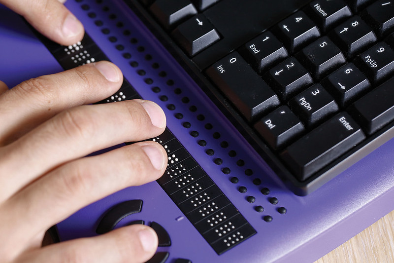 a person's hand on a keyboard