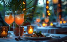 a table with a plate of food and drinks