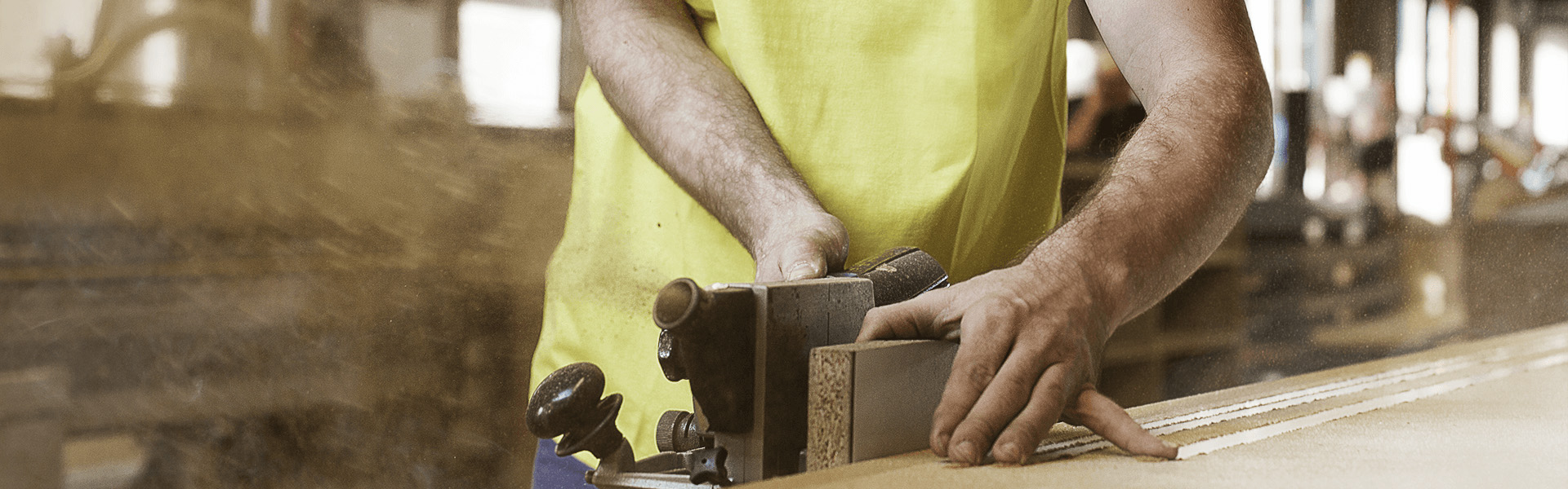 a man using a planer