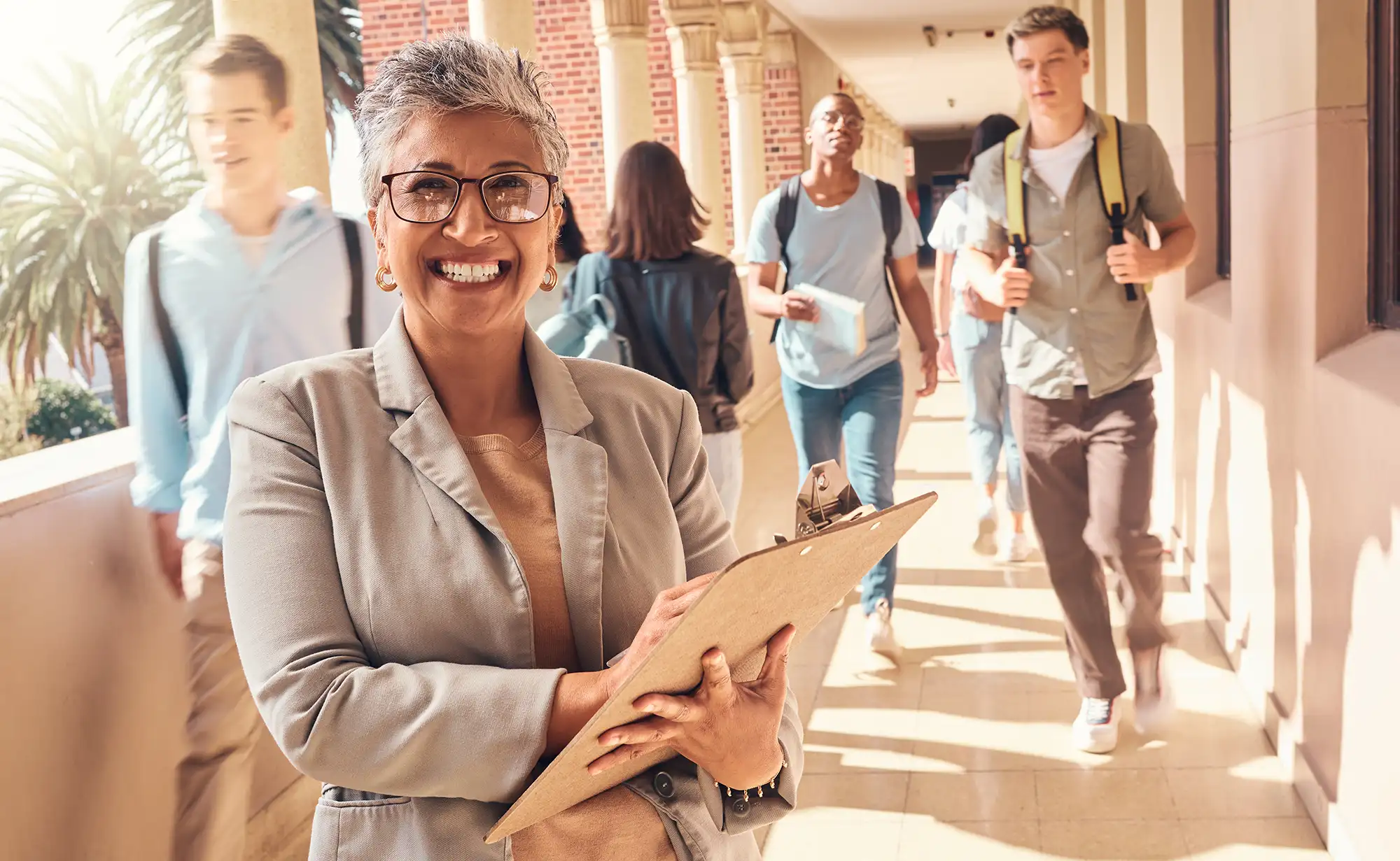 a woman holding a clipboard in a hallway