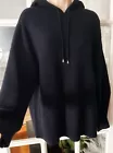 a black sweater on a mannequin