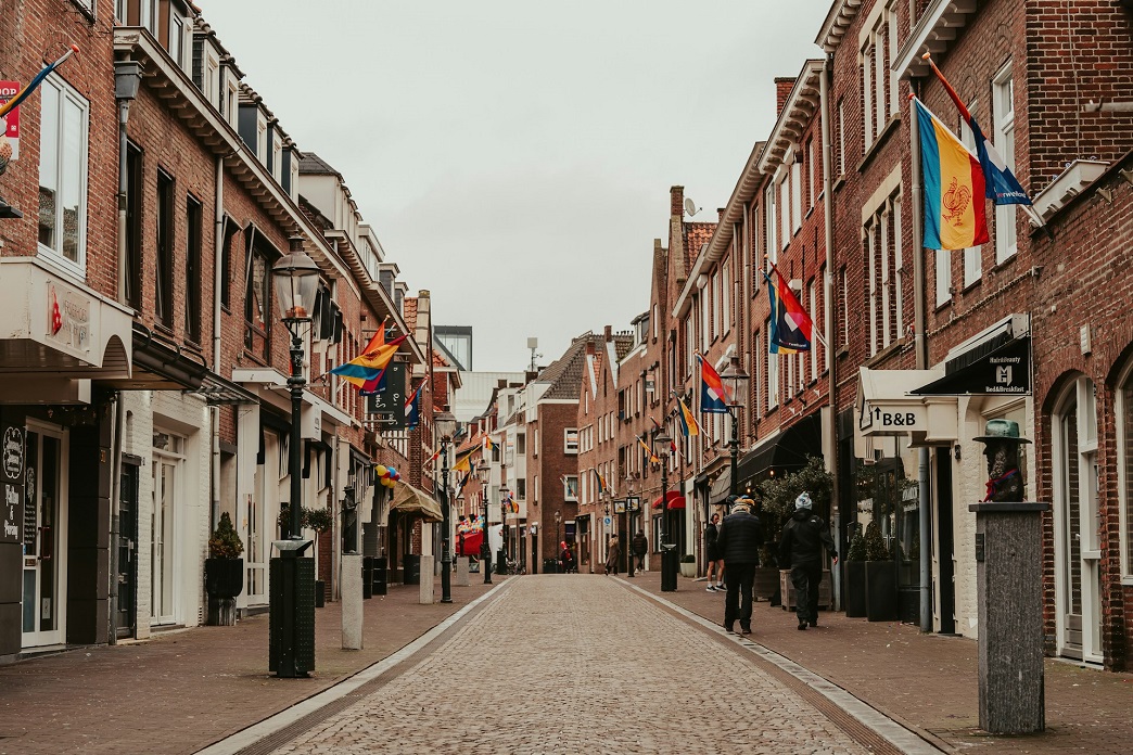 a street with flags on the side