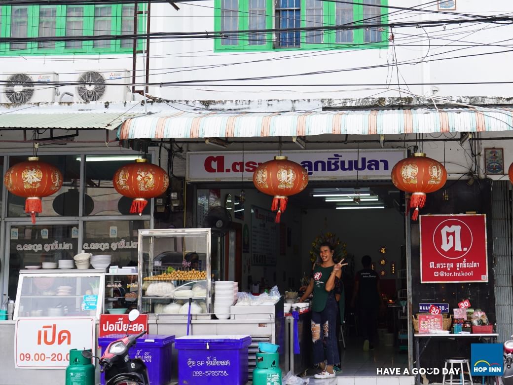 a woman standing in front of a store